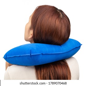 Woman Using A Neck Pillow Isolated On A White Background