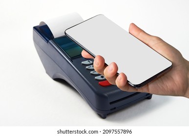 Woman using NFC technology for payment terminal. Hand with smartphone, contactless payment terminal.