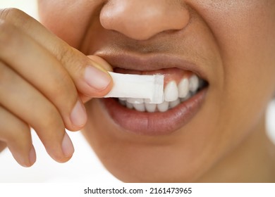 Woman Using Nicotine Gum To Quit Smoking. Nicotine Replacement Therapy