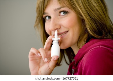 Woman Using Nose Spray