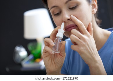 Woman Using Nose Spray