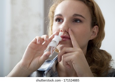 Woman Using Nose Spray