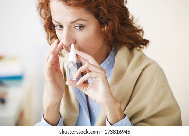 Woman Using Nose Spray