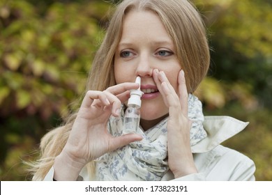 Woman Using Nose Spray