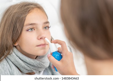 Woman Using Nose Spray To Cure Her Teen Girl At Home