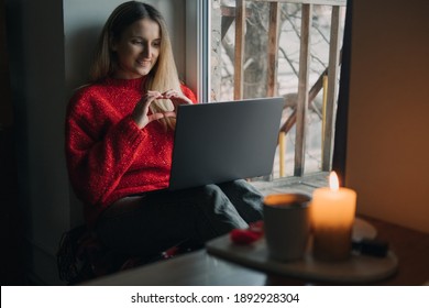 Woman Using Online Dating App On Laptop. Valentines Day During The Coronavirus Outbreak. Love At Distance, Loneliness In Self-isolation In The Time Of Coronavirus.