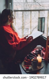 Woman Using Online Dating App On Laptop. Valentines Day During The Coronavirus Outbreak. Love At Distance, Loneliness In Self-isolation In The Time Of Coronavirus.