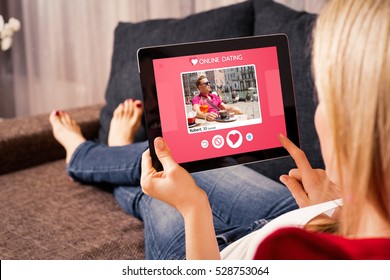 Woman using online dating app on tablet