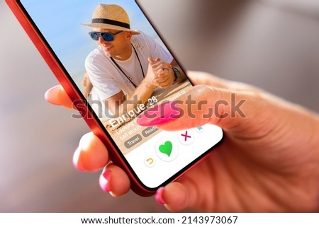 Woman using online dating app on her mobile phone