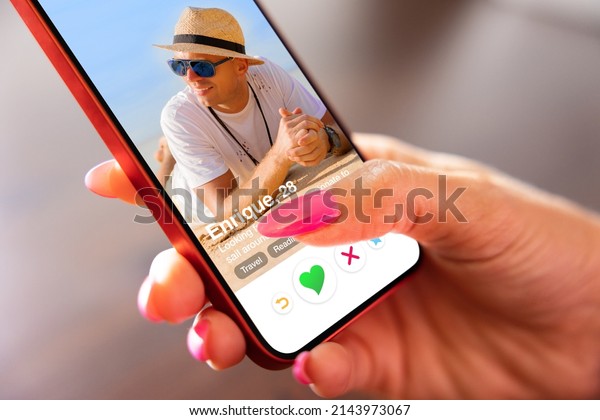 Woman using\
online dating app on her mobile\
phone