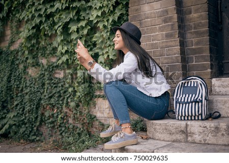 Woman using a phone.