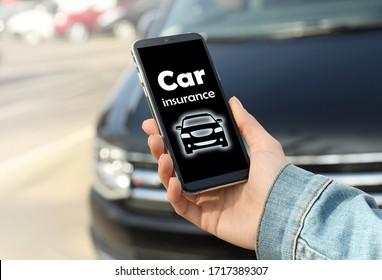 Woman using phone for car insurance outdoors, closeup - Powered by Shutterstock