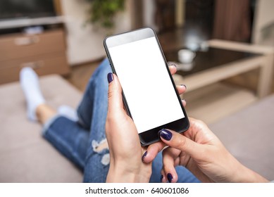 Woman Using Phone With Copy Space At Home On The Couch.
