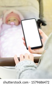 Woman Using Phone During Walking With Baby Carriage.