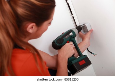 Woman Using Power Drill