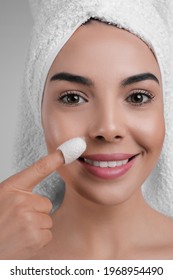 Woman Using Silkworm Cocoon In Skin Care Routine, Closeup