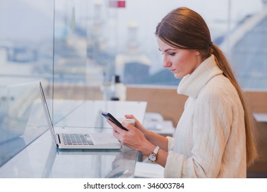 Woman Using Smart Phone In Modern Cafe Interior, Mobile Application, Checking Email 