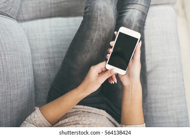 Woman using smartphone - Shutterstock ID 564138424