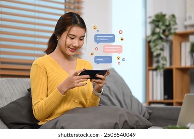 Woman using smartphone with floating chat bubbles and social media icons, messaging or interacting in social media - Powered by Shutterstock