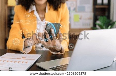 Woman using smartphone and presses his finger on the virtual screen inscription Hosting on desk, Web hosting concept, Internet, business, digital technology concept.
