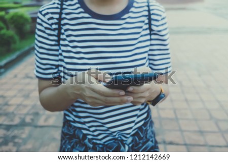 Similar – Young Woman Checking Her Mobile Phone