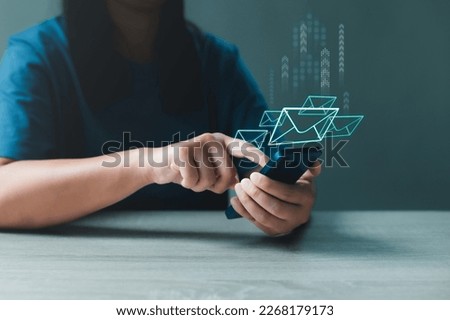 Woman using smartphone sends and receives email with envelopes icon for communicates with clients and friends online. Email marketing, newsletter and online communication concept.