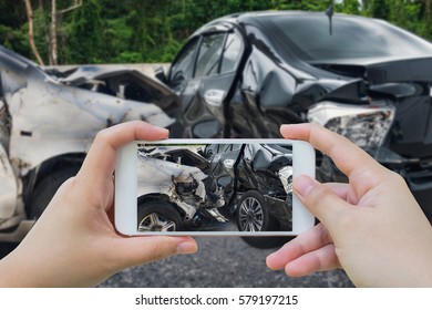 Woman Using Smartphone Take Photo Of Car Crash Accident On The Road