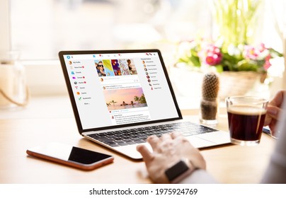 Woman using social media on laptop computer