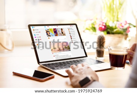 Woman using social media on laptop computer