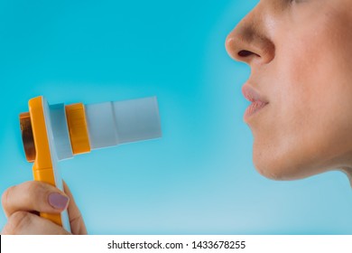 Woman Using Spirometer  Measuring Lung Capacity