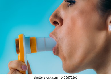 Woman Using Spirometer  Measuring Lung Capacity