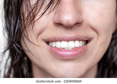 Woman Using Spray On Wet Hair Isolated.smiling Girl With Wet Hair Long Bangs Chaotic On Face Hold In Hand Bottle With Oil Spray Keratin For Extra Shine Healthy Structure.parts Of Face Closed Eye Relax