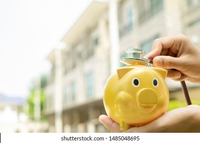Woman using stethoscope with piggy bank show home inspection or check the financial condition for Buying or living concept.