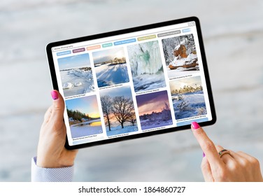 Mujer usando tablet y navegando por la hermosa fotografía de invierno en línea