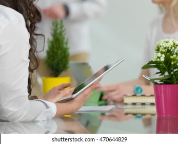 Woman using a tablet computer. Close up.