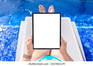 Woman Using Tablet Computer Poolside, Empty Vertical Screen Mockup