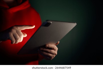 Woman is using tablet pc. Computer and hands close up.