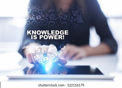 Woman is using tablet pc, pressing on virtual screen and selecting knowledge is power!.