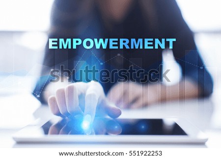 Woman using tablet pc and selecting empowerment.