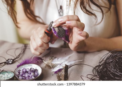 Woman using tools for making gemstone jewellery, home workshop. Women artisan created jewellery. Art, hobby, handcrafted concept - Powered by Shutterstock