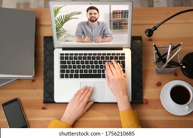 Woman Using Video Chat For Online Job Interview In Office, Top View 