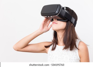 Woman using VR headset - Shutterstock ID 534195763