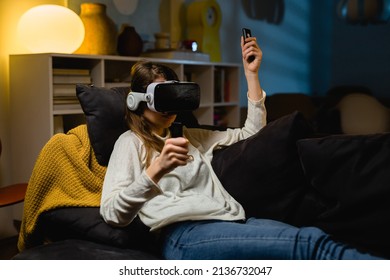 Woman Using VR Set At Home