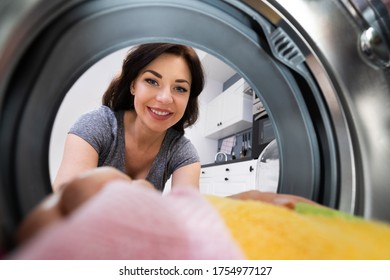 Woman Using Washing Machine Appliance Or Cloth Dryer