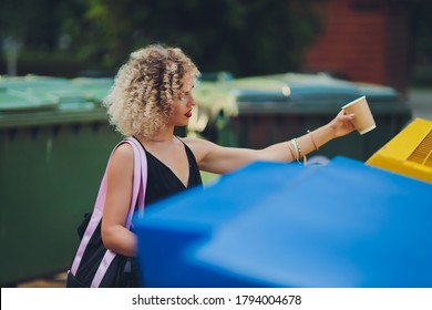 Woman Using Waste Separation Container Throwing Away Coffee Cup Made Of Styrofoam.