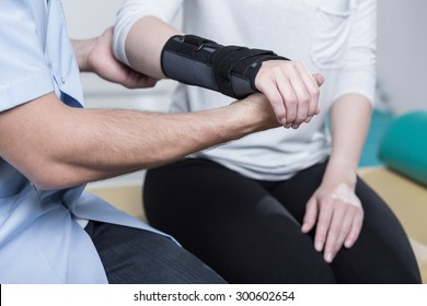 Woman using wrist immobiliser after hand's injury - Shutterstock ID 300602654