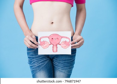 Woman With Uterus Health Concept On The Blue Background