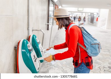 Woman validating ticket on modern public train transport - Powered by Shutterstock