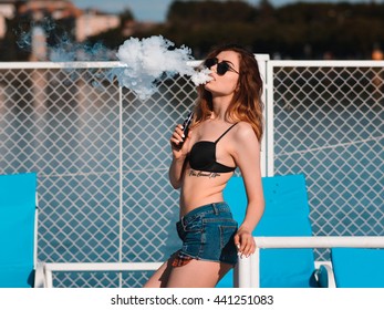 Woman vaping e-cigarette