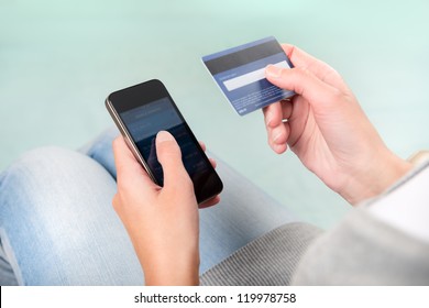 Woman Verifies Account Balance On Smartphone With Mobile Banking Application.